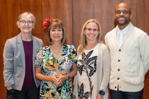 This is an image of Demi, president of WICHE, standing beside past chair Jefferson and new chair Damron and new vie chair Millner